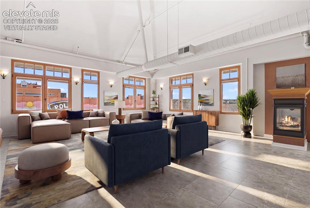 Image 4 of 50: Expansive living spaces, architectural details, & abundant natural light. V