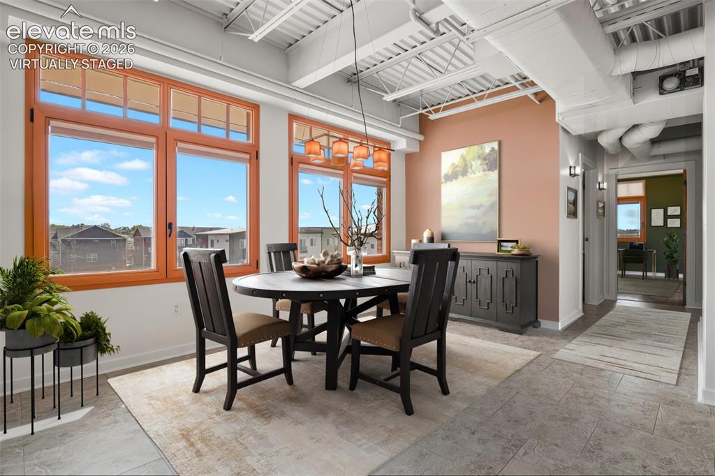 Image 9 of 50: Separate dining area. Virtually Staged