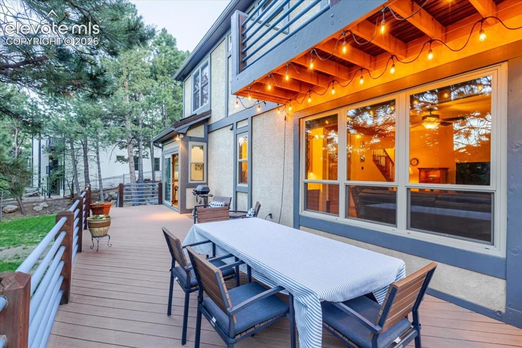 Image 45 of 50: Spacious wood-finish deck with horizontal slat railings