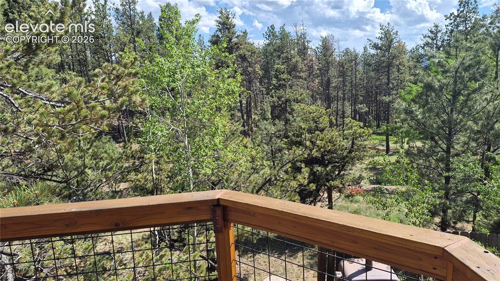 Image 2 of 6: Looking down on extra lot from Main Level Deck