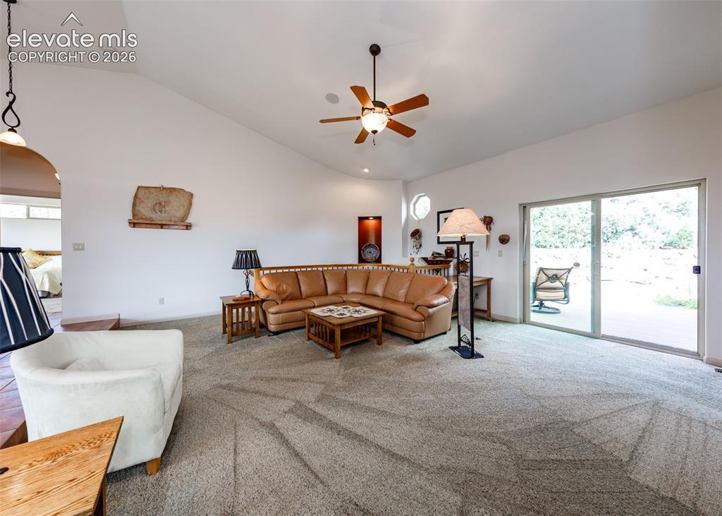 Image 16 of 43: Very light and bright main level with walkout from the living room to the b