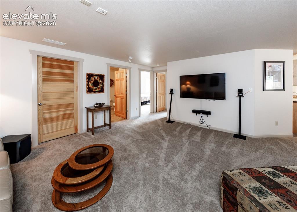 Image 33 of 50: Large lower level family/theater room with plenty of space for everyone!