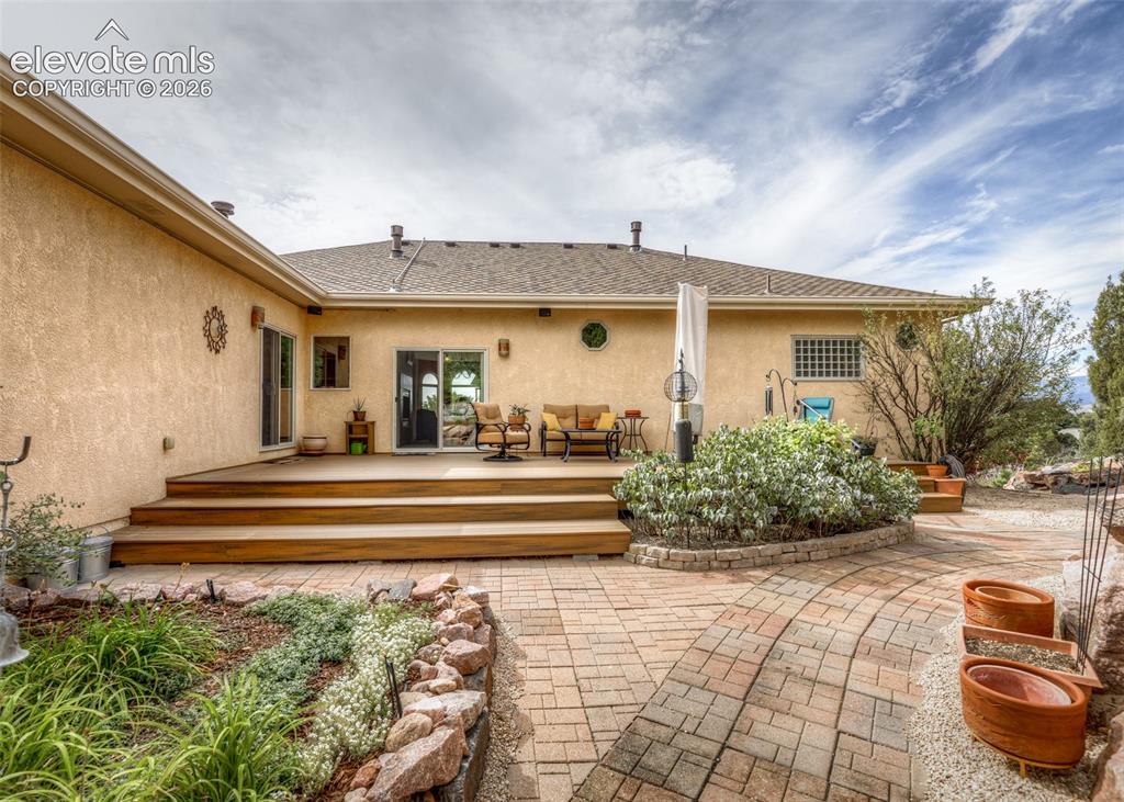 Image 41 of 43: Step out to this serene backyard from multiple access points and enjoy the