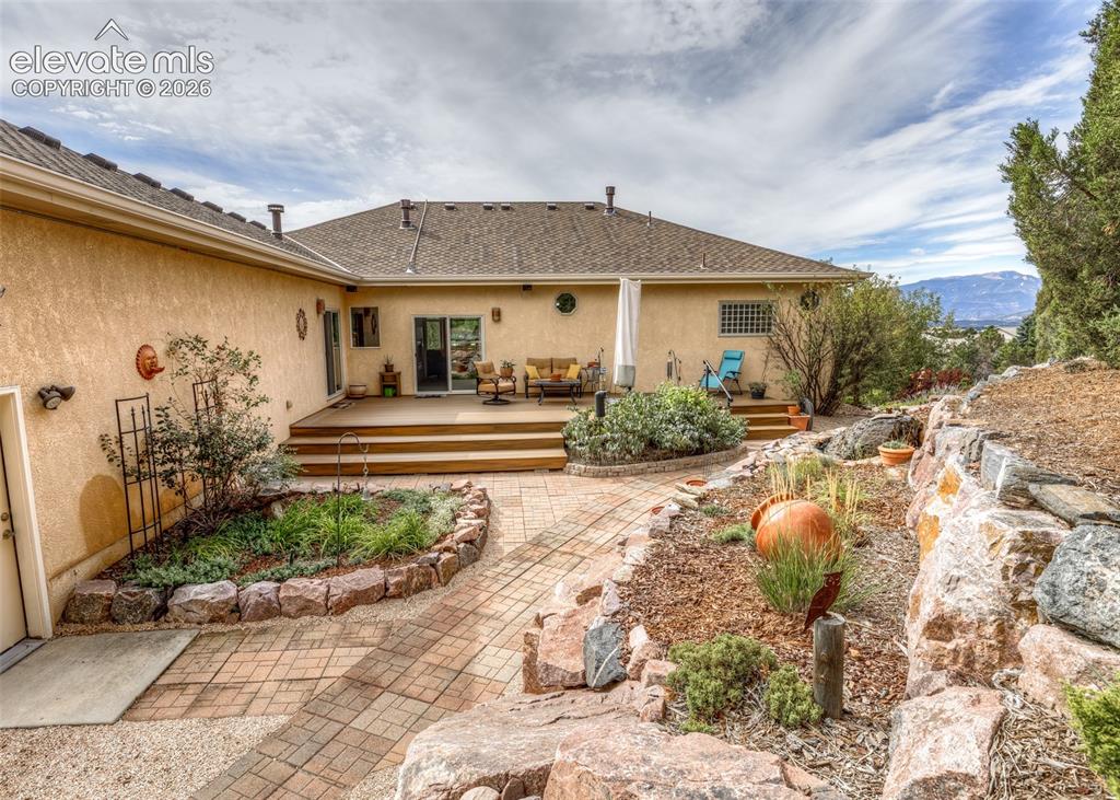 Image 42 of 43: This amazing backyard includes stone retaining walls, stone pathways, seven