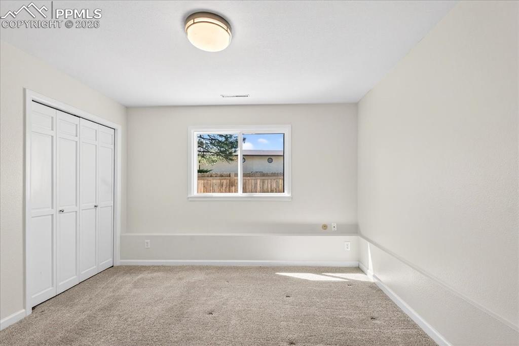 Image 25 of 48: Unfurnished bedroom featuring a closet and carpet