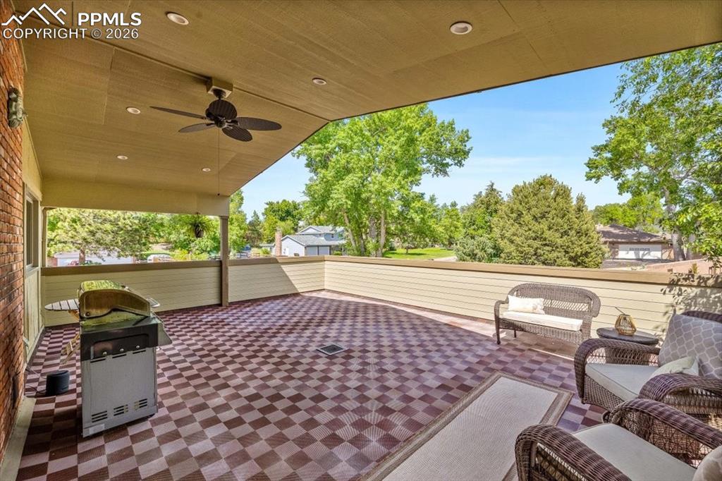 Image 33 of 48: View of patio / terrace with ceiling fan and area for grilling