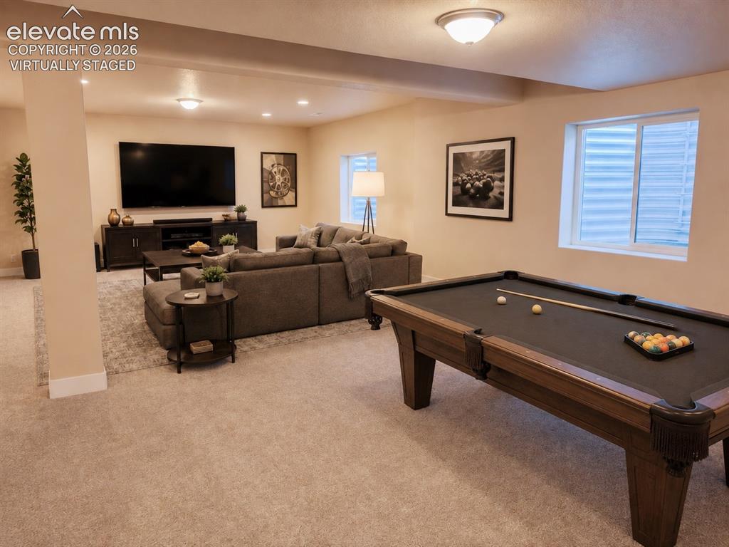 Image 39 of 50: Basement Dining Area with wet bar.