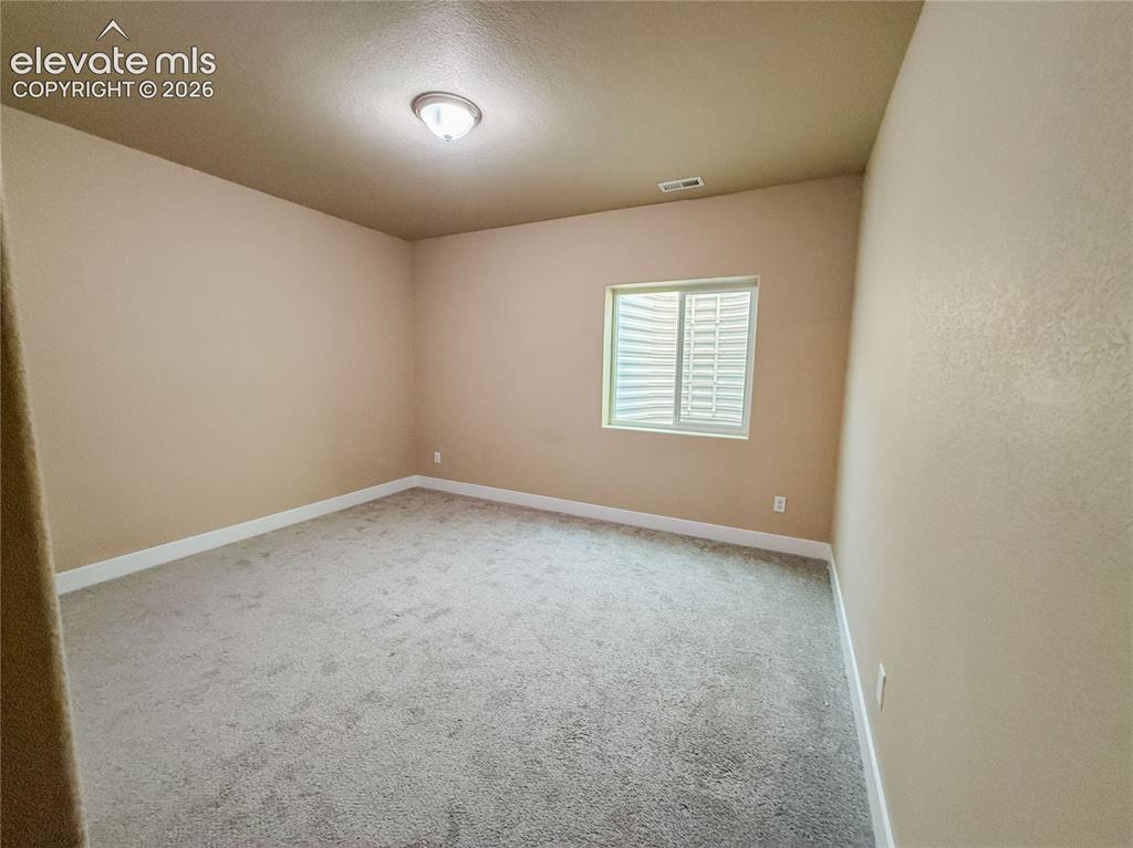 Image 43 of 50: Virtually staged Basement bedroom.