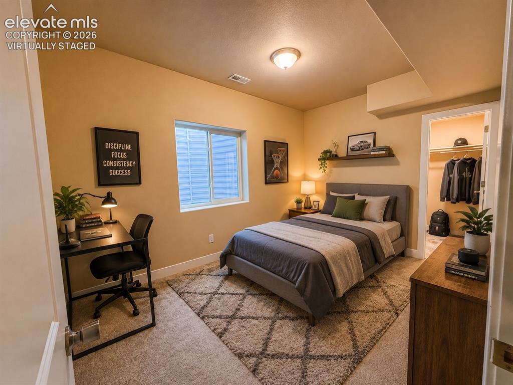 Image 44 of 50: Basement bedroom