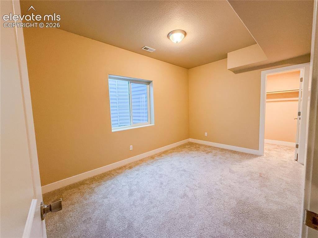 Image 45 of 50: Virtually staged Basement bedroom