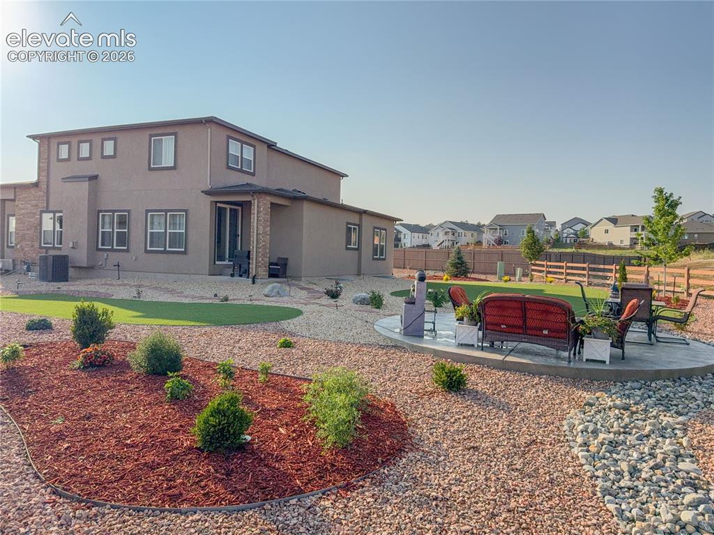 Image 48 of 50: The actual aerial view during sunset. The property is located along the bea