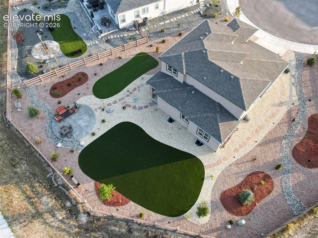 Image 49 of 50: Beautiful  and professionally landscaped backyard with tomatoes chili and g