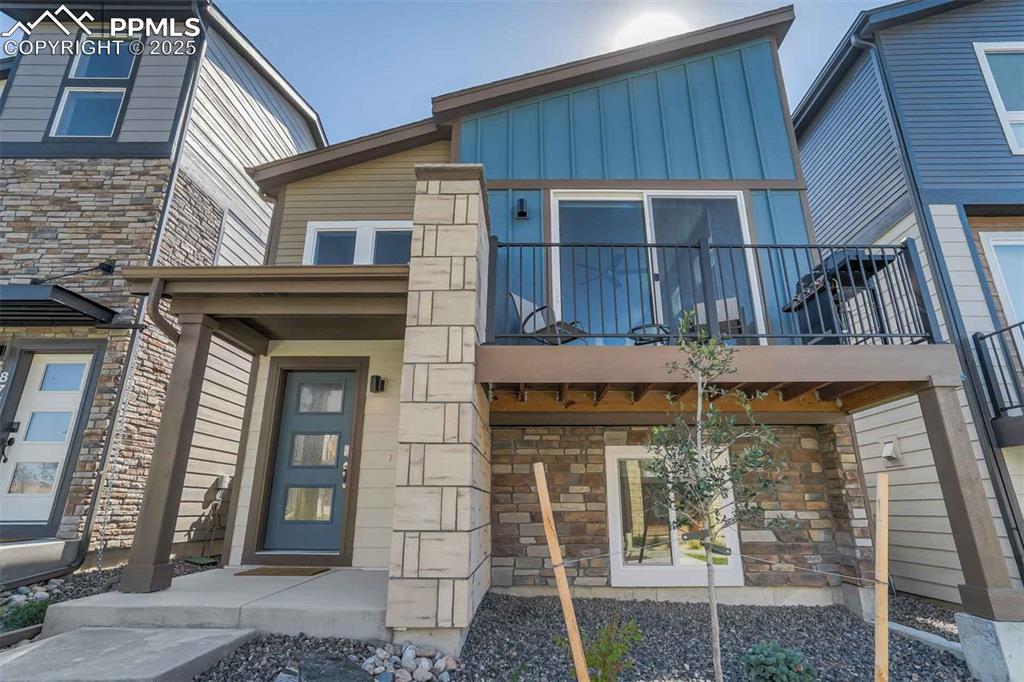 Caption: Entrance to property with stone siding