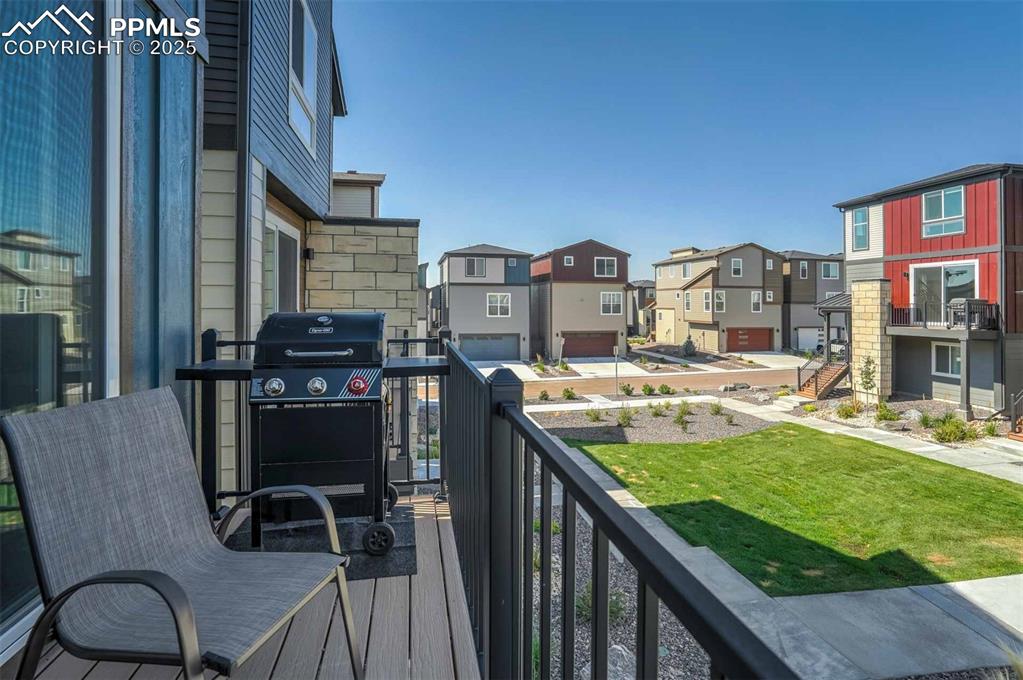 Image 39 of 42: Balcony featuring grilling area and a residential view