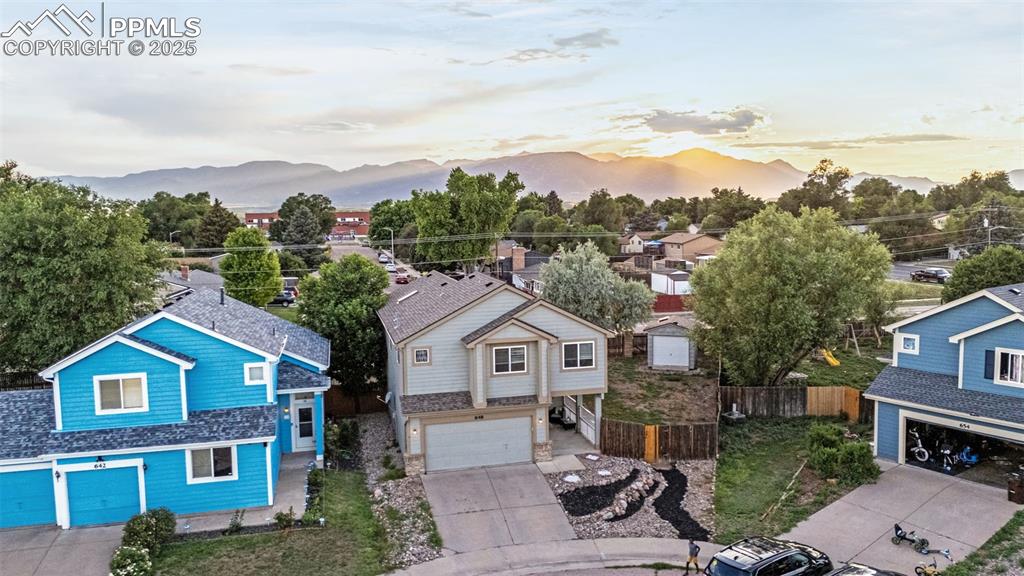 Image 40 of 40: Aerial view at dusk of a mountain view and a residential view