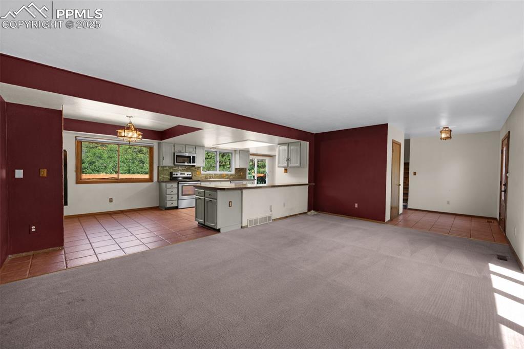 Image 15 of 47: looking in to open kitchen