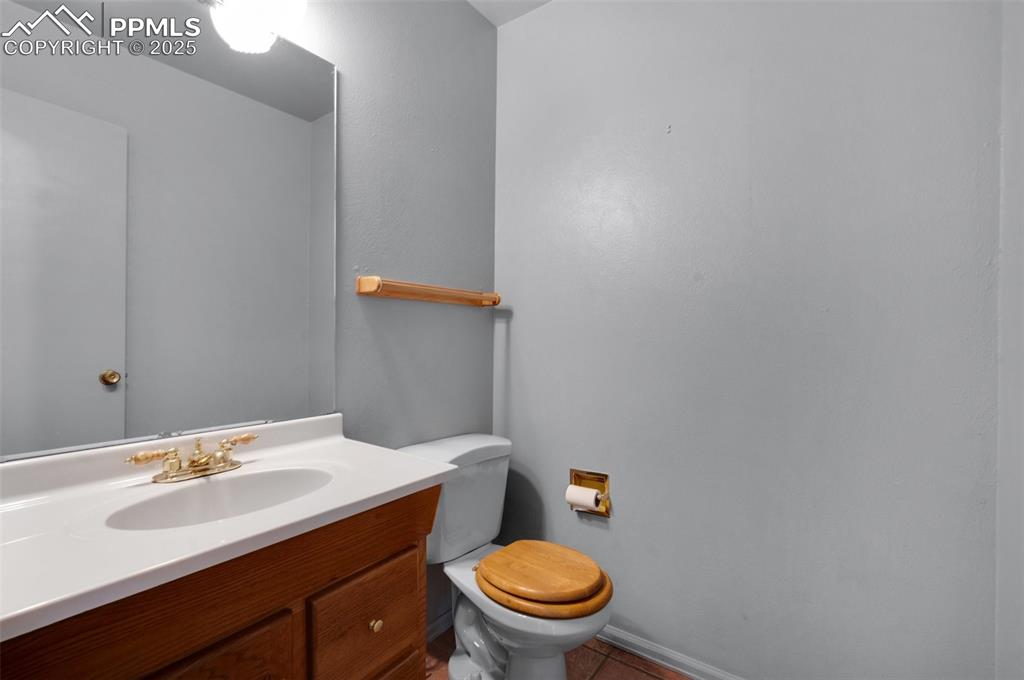 Image 24 of 47: main level powder room