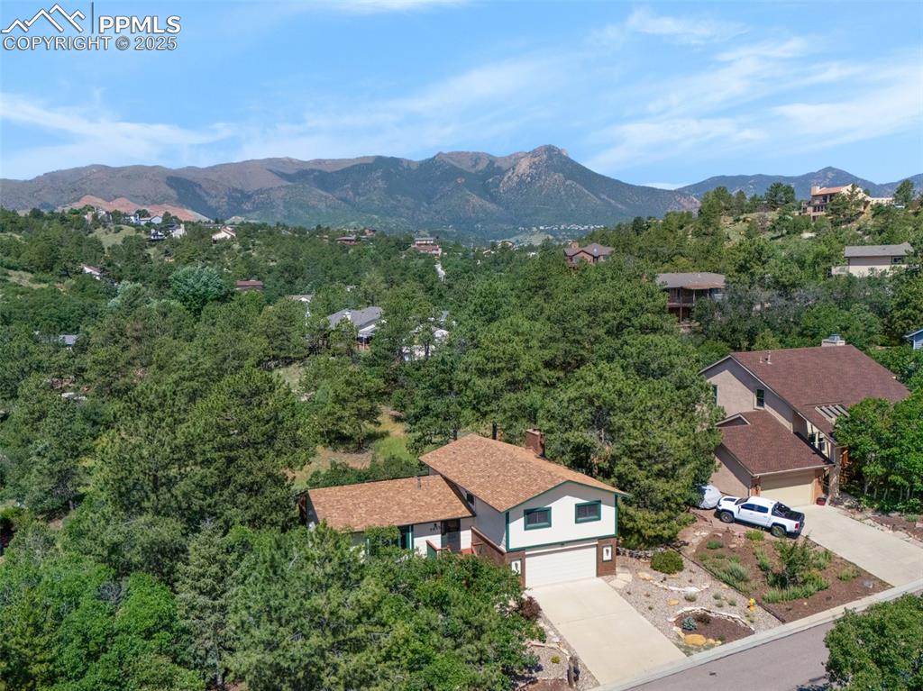 Image 3 of 47: Aerial view of a mountain backdrop