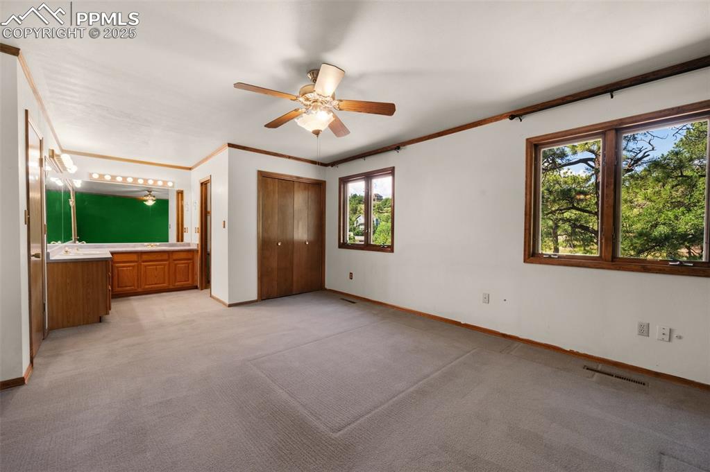 Image 32 of 47: looking towards adjoining bath with double vanity, and shower