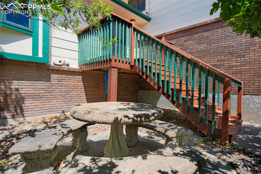 Image 6 of 47: View of exterior entry with brick siding