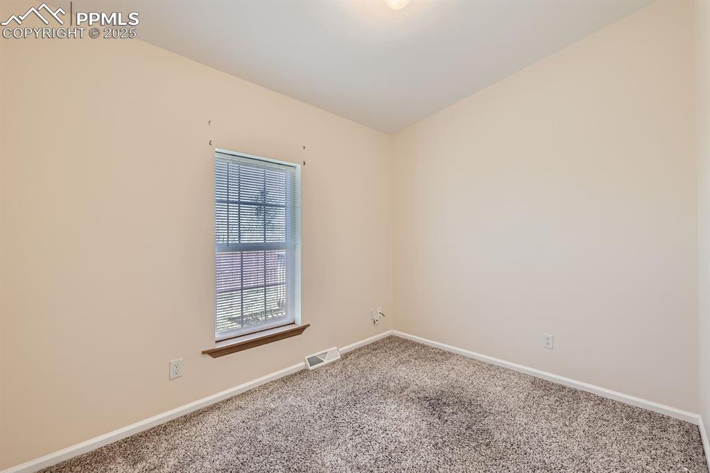 Image 20 of 28: Carpeted empty room with baseboards