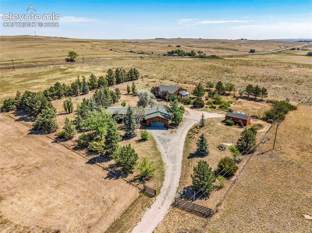 Image 43 of 49: Expansive property featuring a main residence, secondary dwelling, and addi