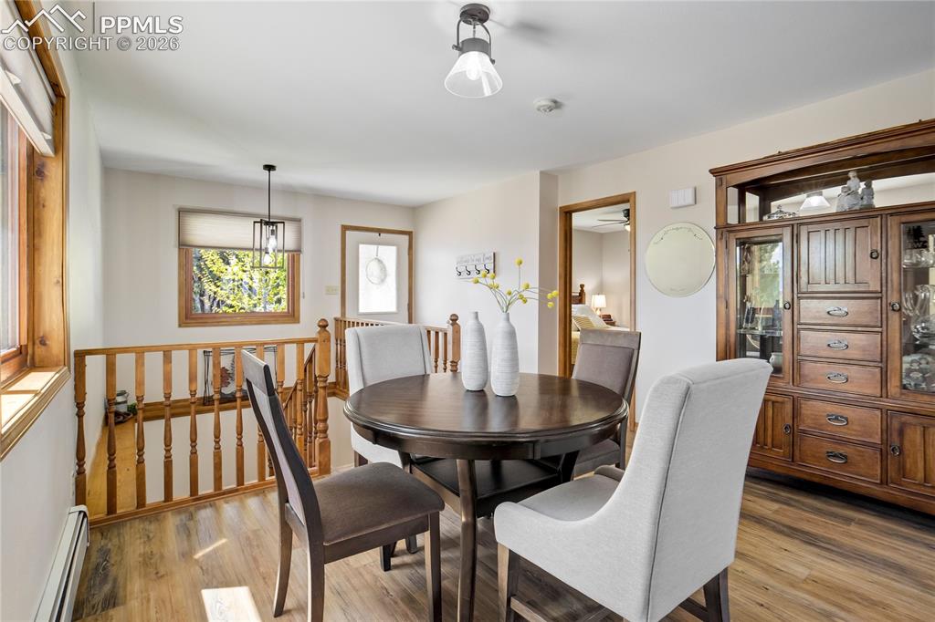 Image 12 of 50: Bright and cheery dining room