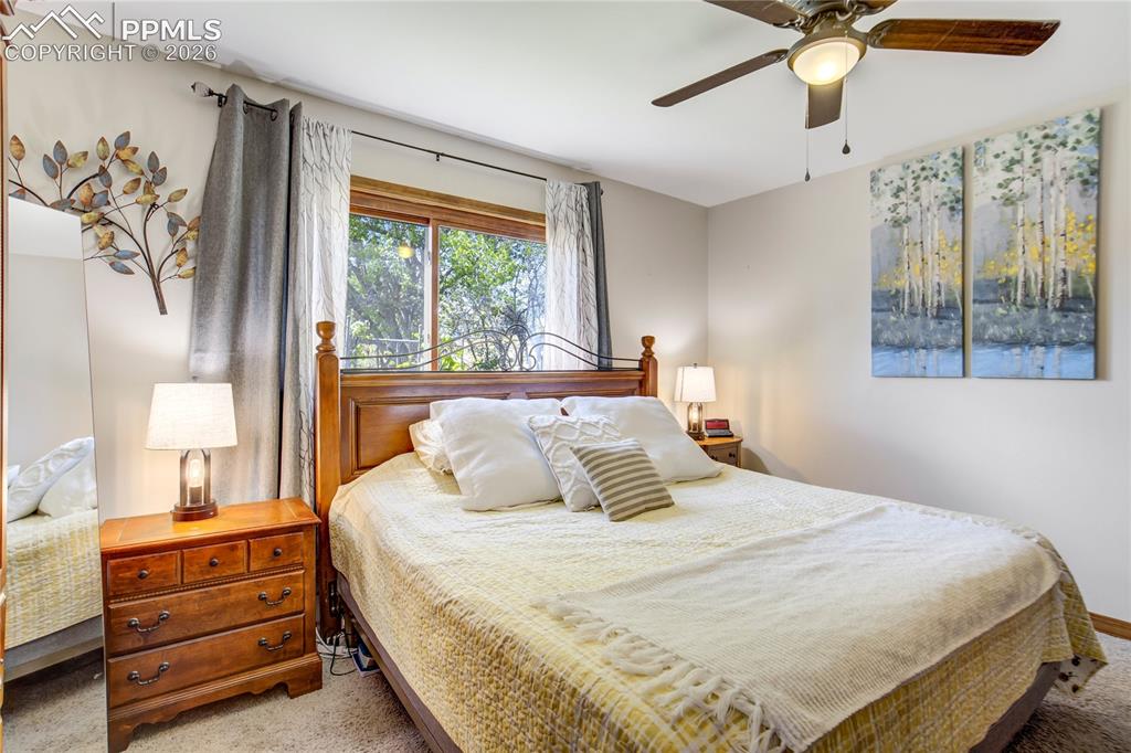 Image 15 of 50: Charming primary bedroom