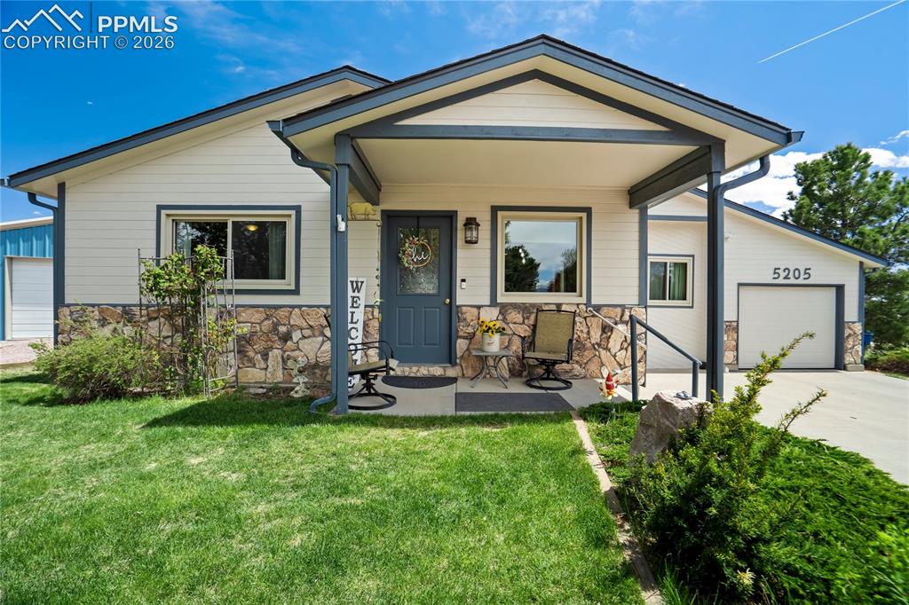 Image 2 of 50: Charming front of home on large half acre lot