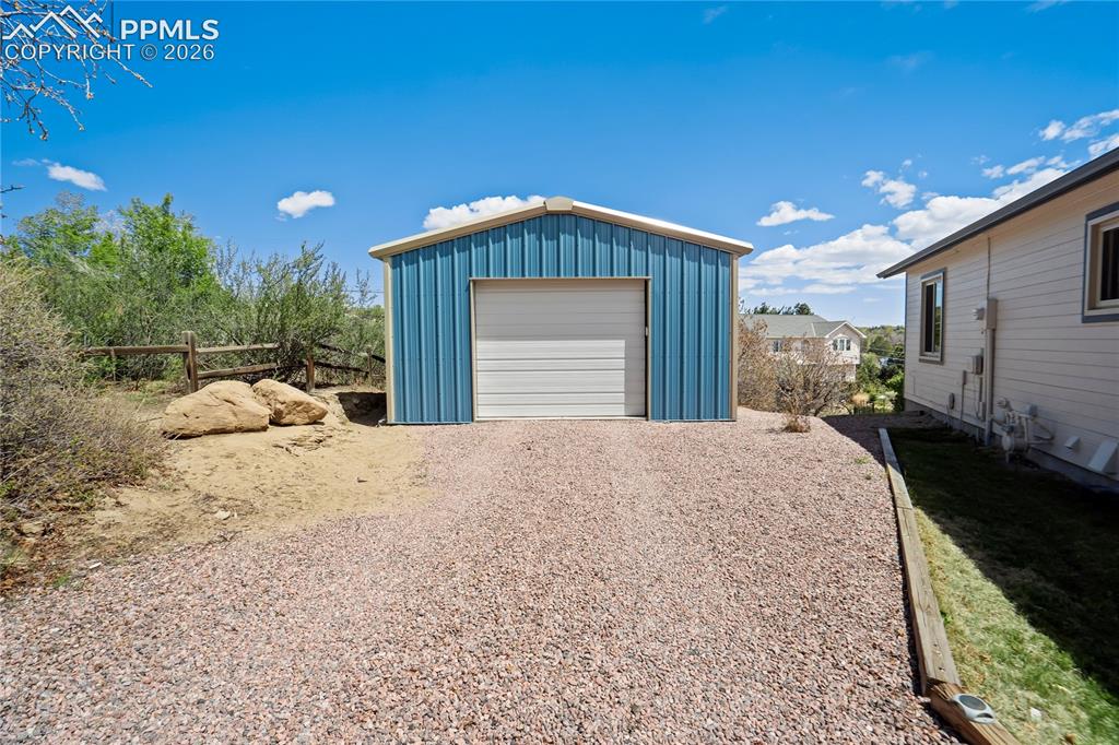 Image 43 of 50: Steel 20x30 workshop provides additional parking too!