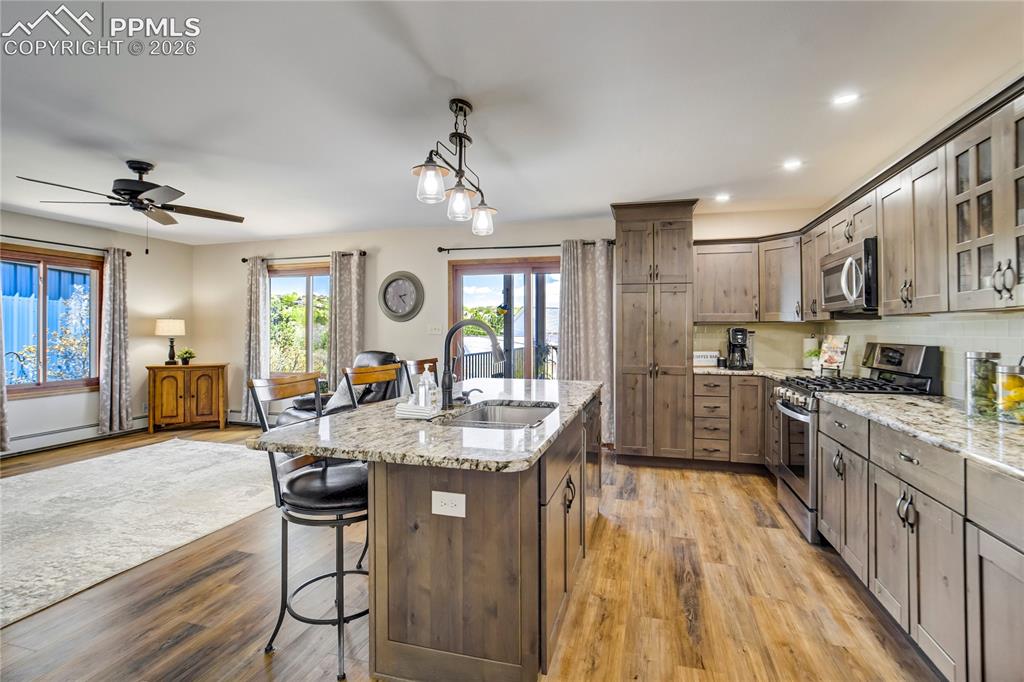 Image 7 of 50: Center island between kitchen and family room