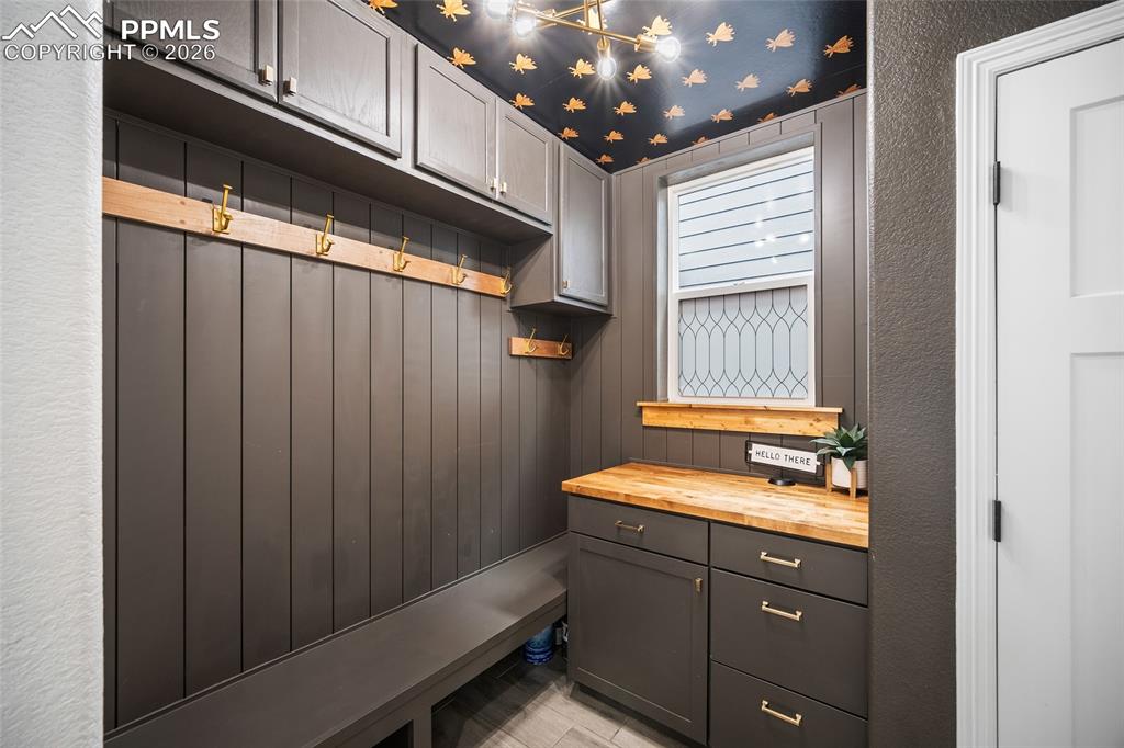 Image 10 of 50: Mudroom with a shiplap textured wall