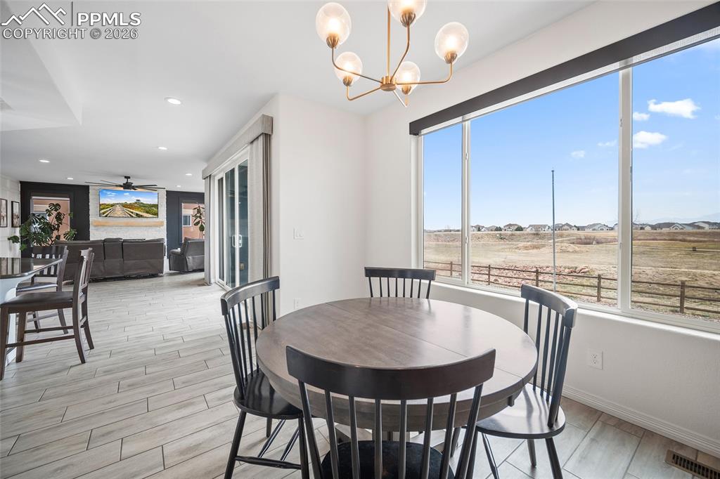 Image 14 of 50: Dining area featuring light wood-type flooring, baseboards, recessed lighti