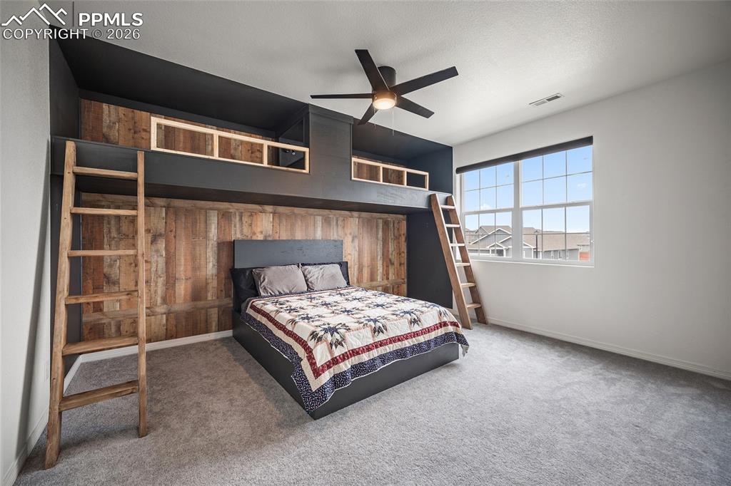 Image 33 of 50: Carpeted bedroom with built in bunk beds