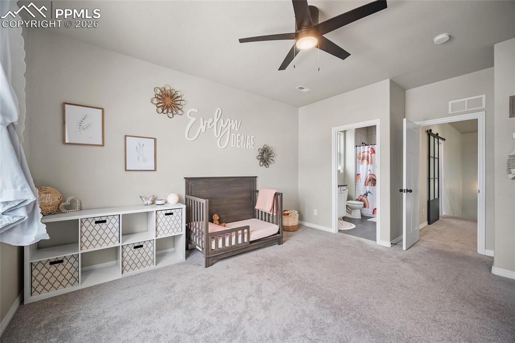 Image 34 of 50: Bedroom featuring carpet, , and baseboards
