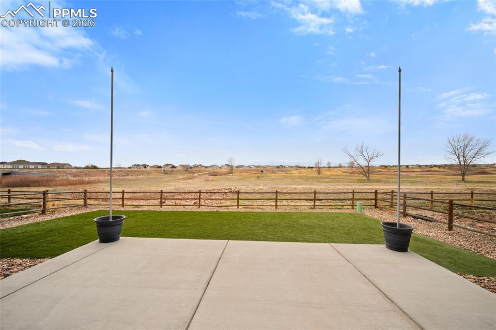 Image 44 of 50: View of patio / terrace with golf course and pikes peak mountain view