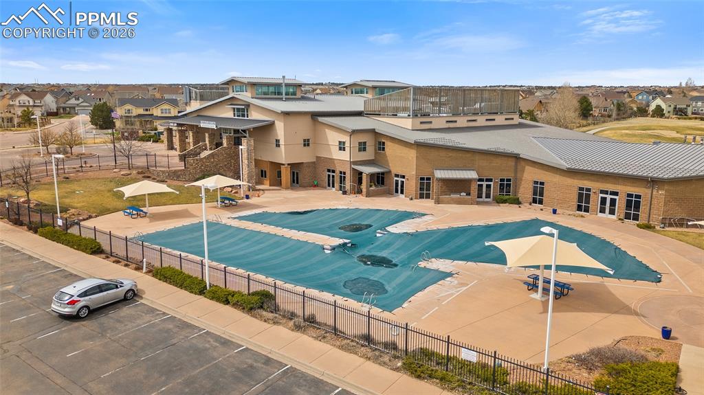 Image 45 of 50: View of pool featuring a residential view, a patio, and fence