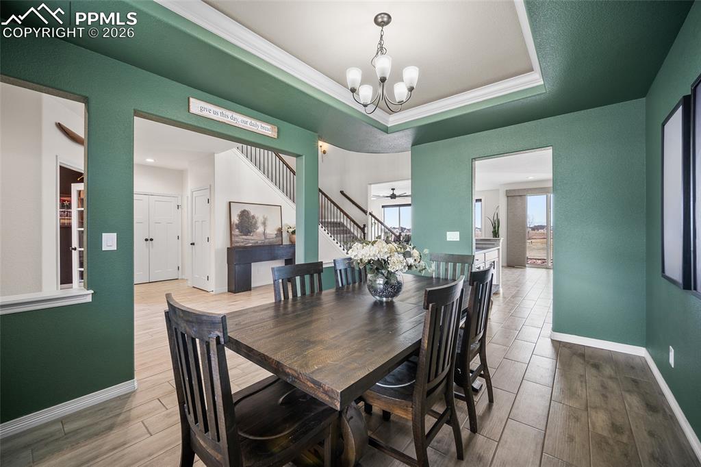 Image 6 of 50: Dining space with tray ceilings