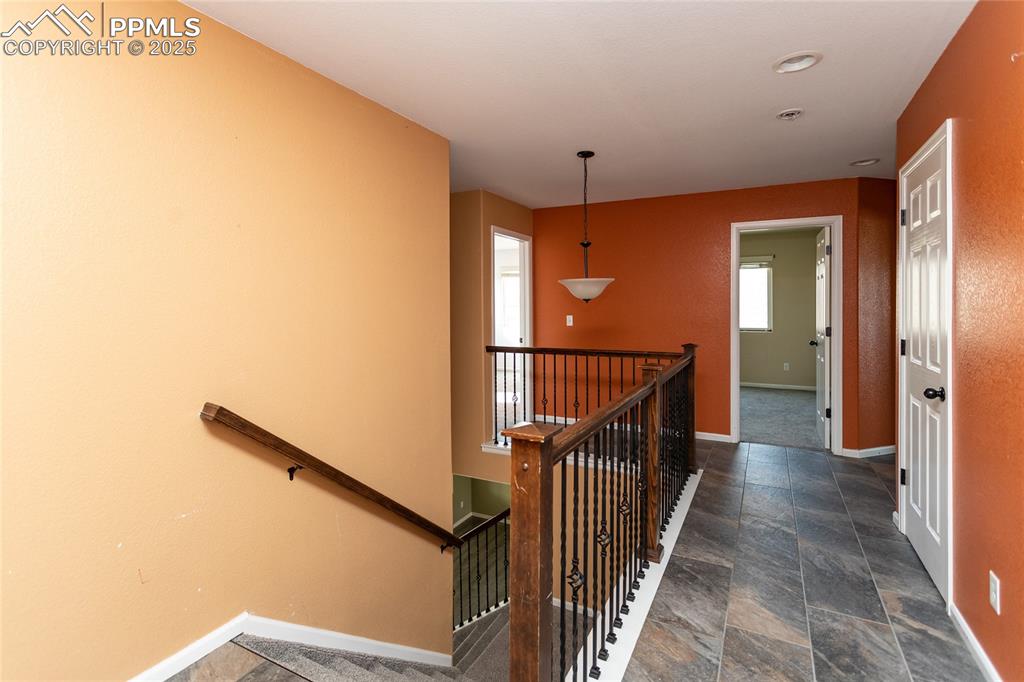 Image 19 of 49: Stairway featuring baseboards