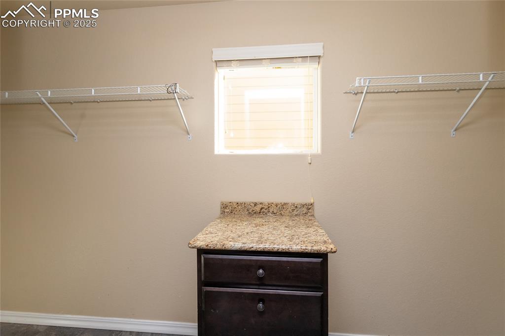 Image 24 of 49: View of walk in closet