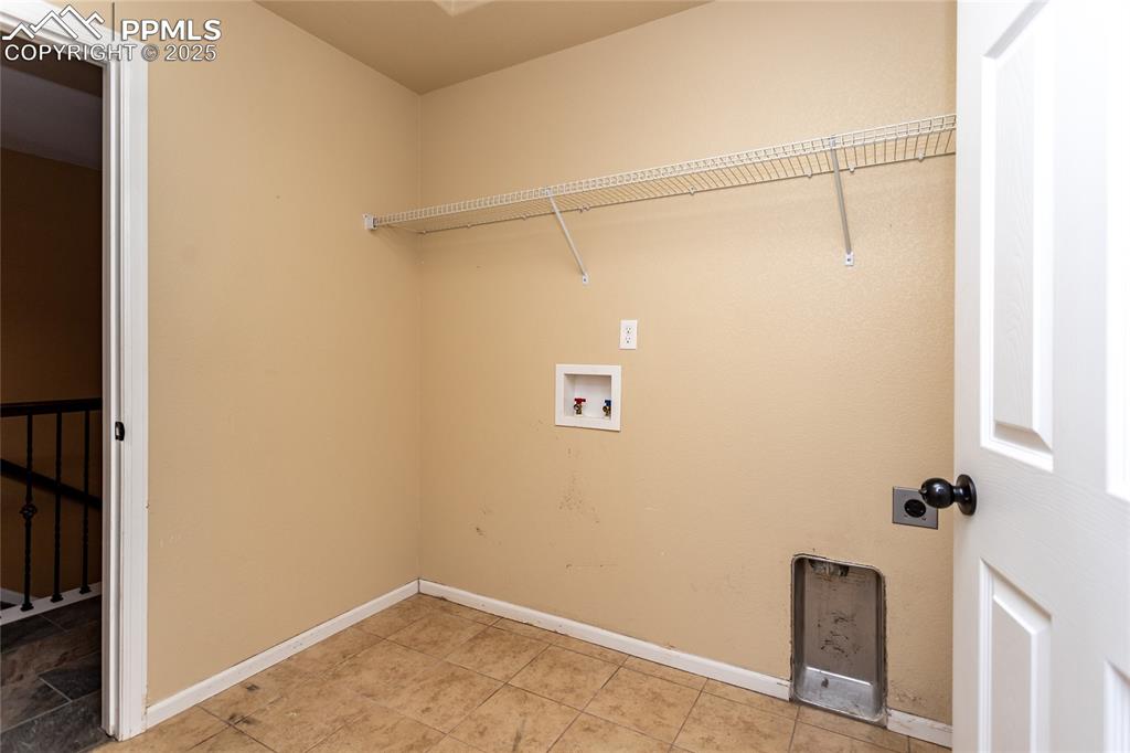 Image 28 of 49: Washroom featuring hookup for a washing machine and hookup for an electric