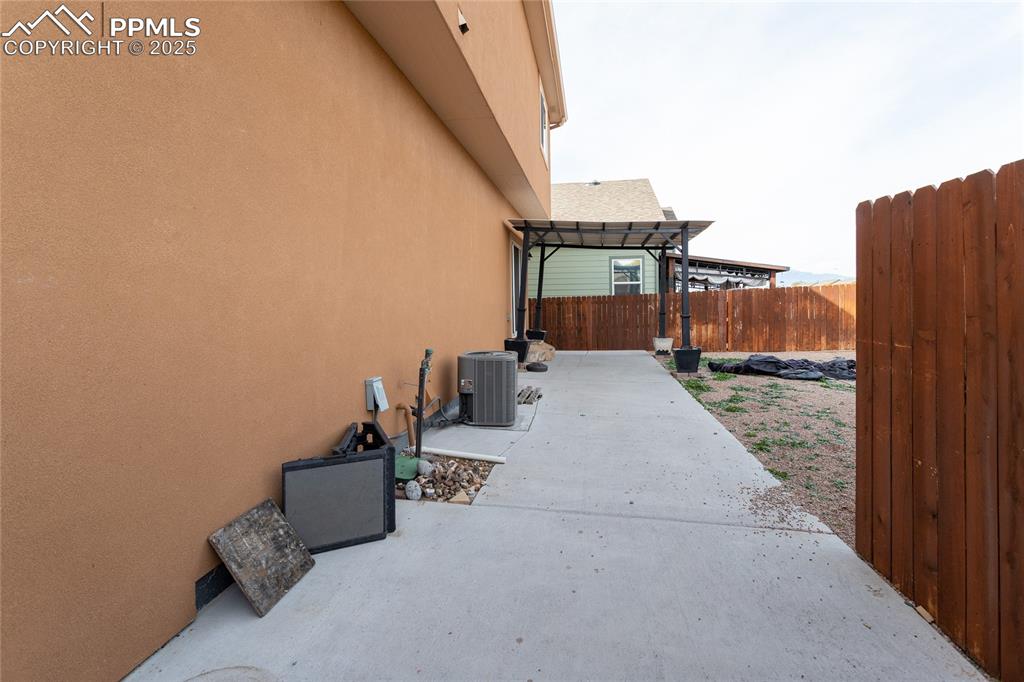 Image 46 of 49: View of patio featuring a pergola