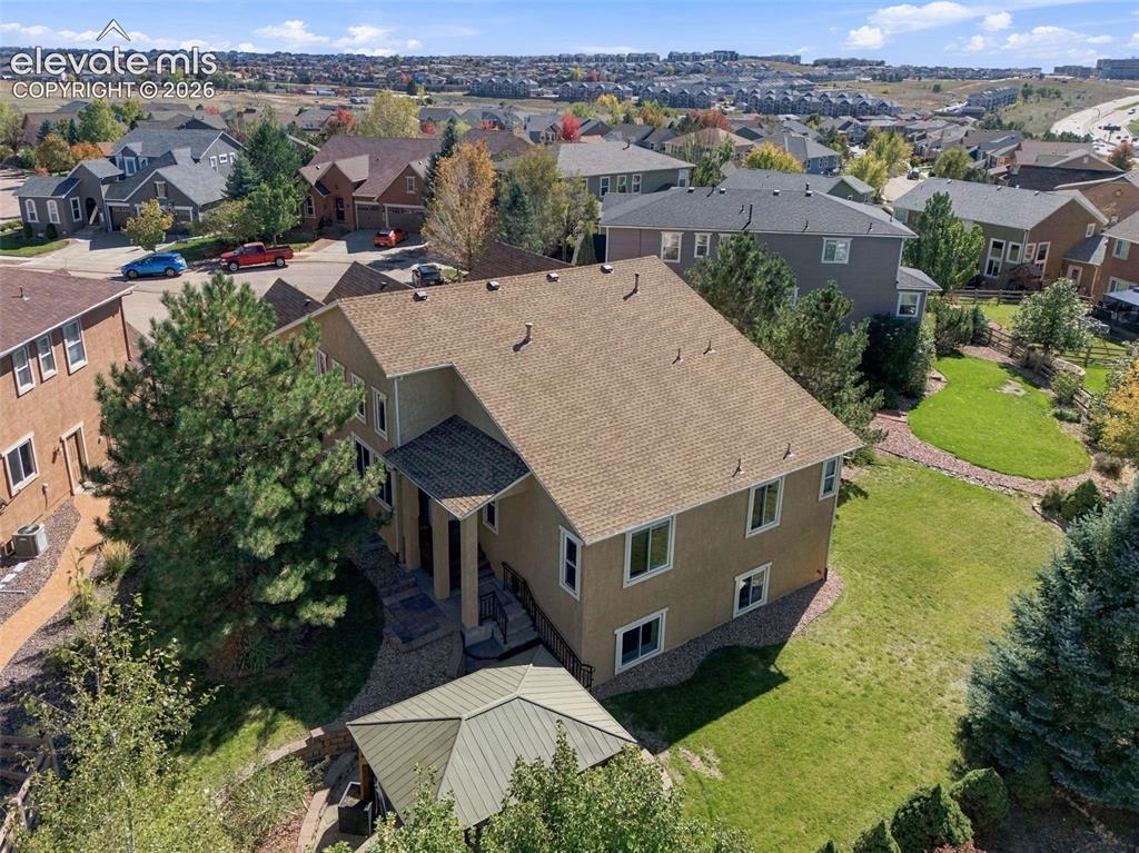 Image 48 of 48: Stucco exterior residence featuring an asphalt shingle roof, integrated sto