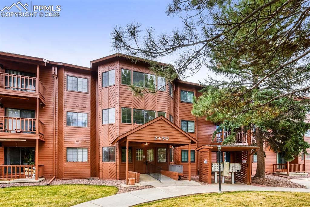 Image 1 of 32: Courtyard entry to lobby and elevator