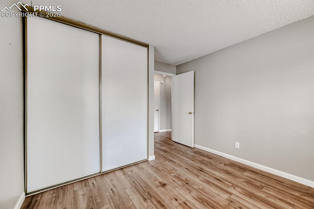 Image 12 of 32: Doorway to hallway and laundry area