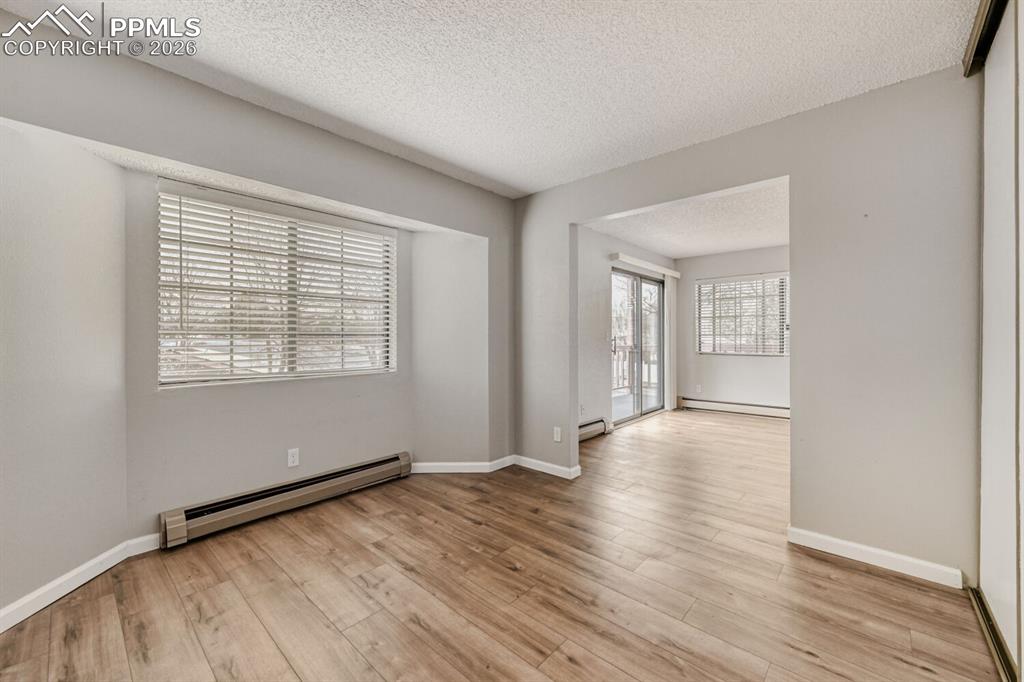 Image 7 of 32: Secondary bedroom  or office open to living room