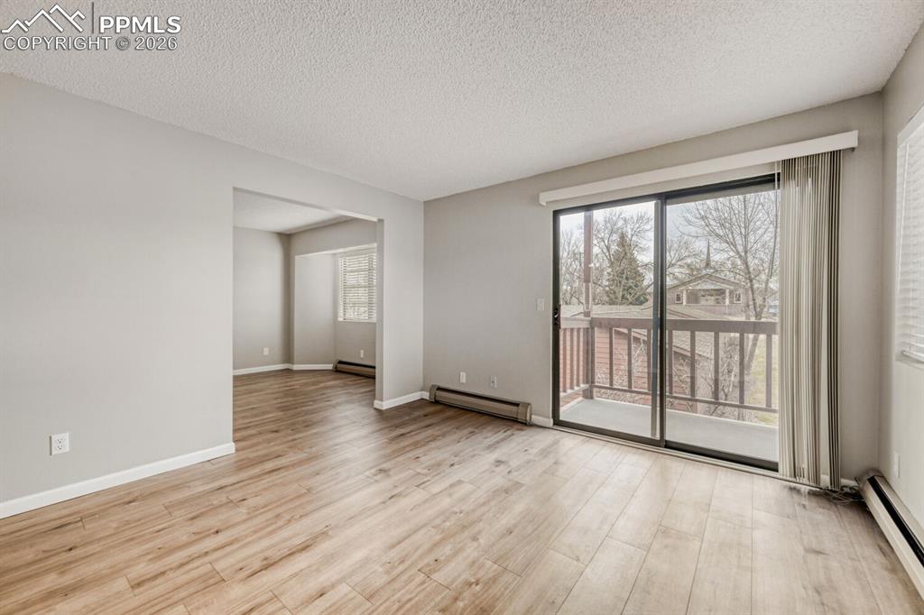 Image 8 of 32: Access to second bedroom which could be used as a Den or Office. Sliding do