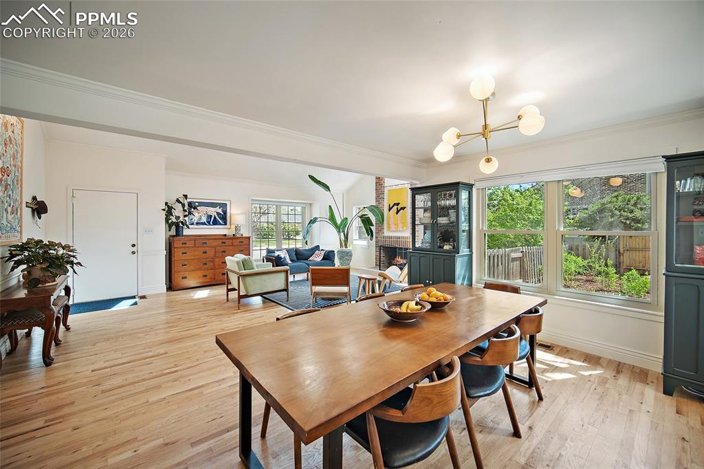 Image 12 of 50: Cabinets on each side of the windows convey with the sale. Upgraded lightin