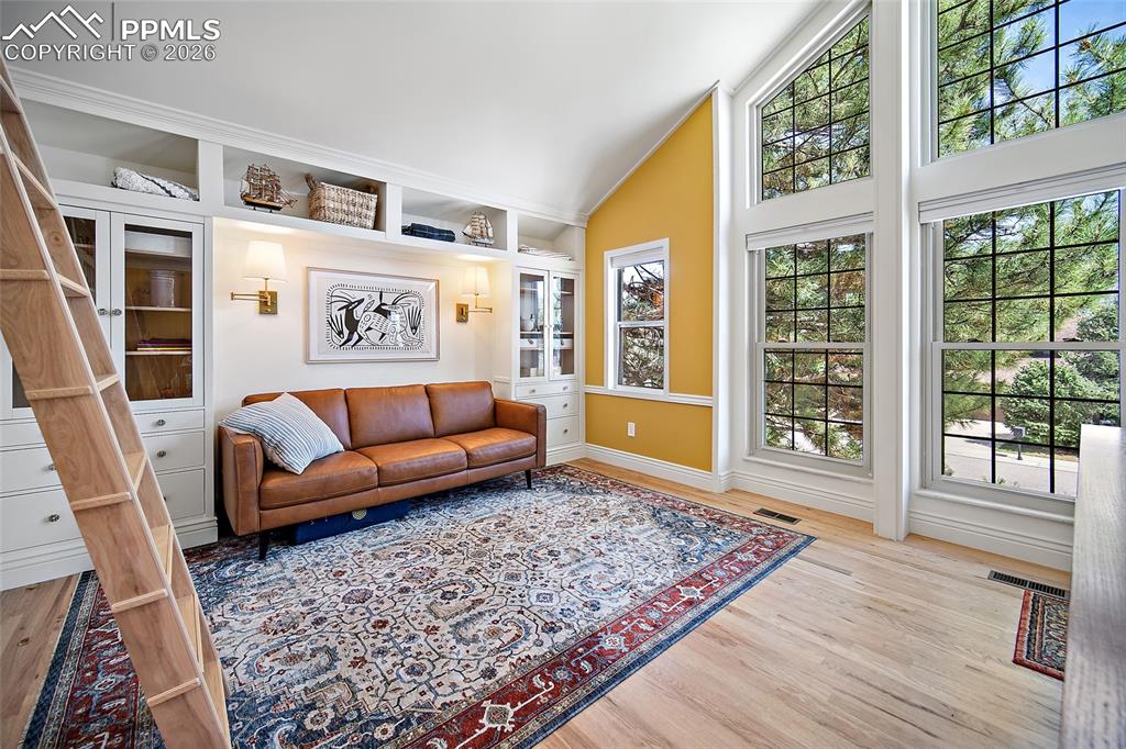 Image 28 of 50: Large windows allowing natural light to flood this room! 