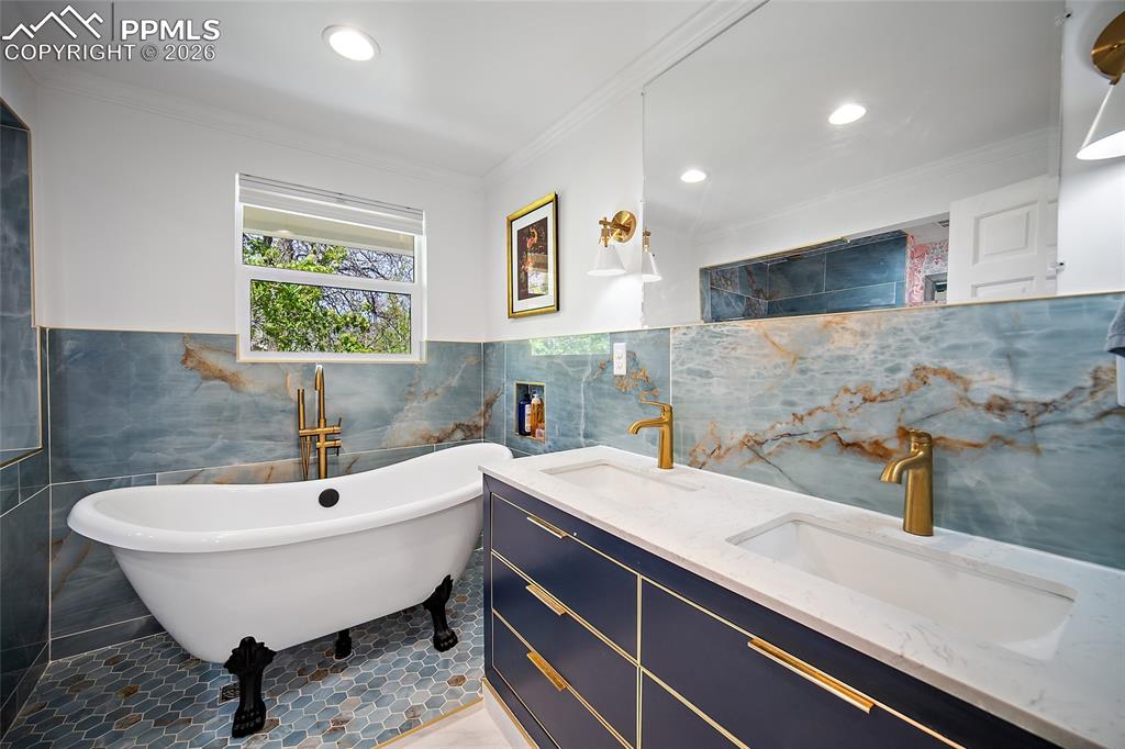 Image 29 of 50: The bath is on a shower flooring which has its own drain. it makes the tub 